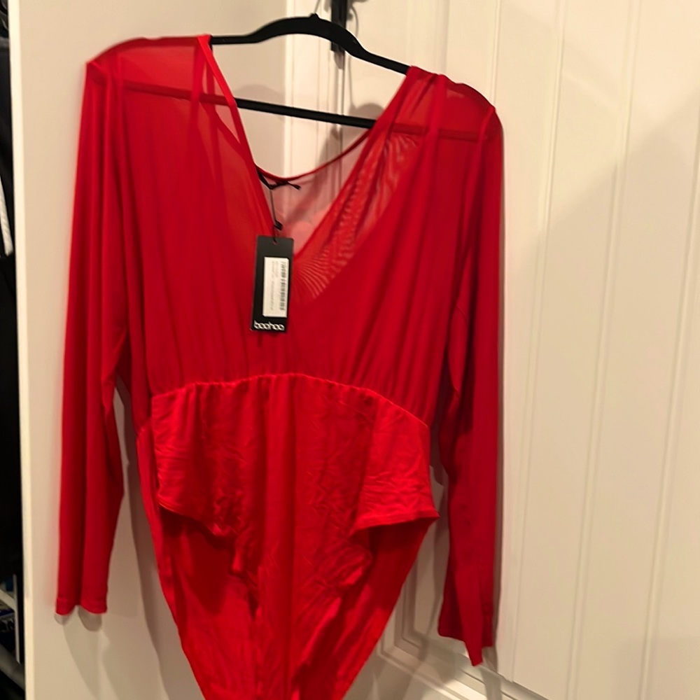 New with tags. Red bodysuit with thin, mesh upper. Snap closure between legs.
